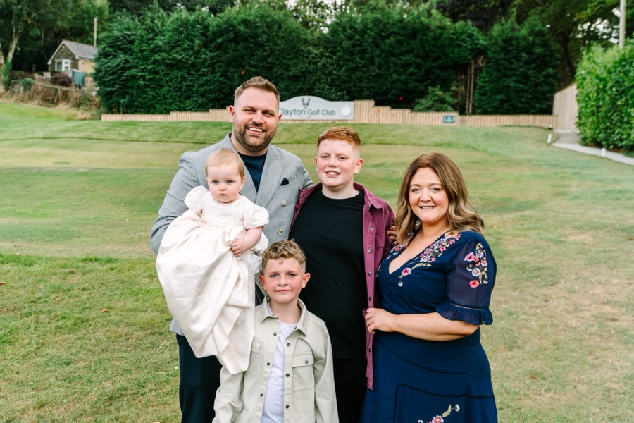 Michael with his family at Grace’s baptism